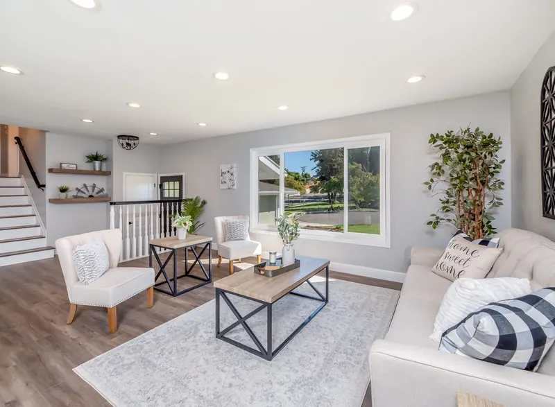 A bright living room with wide-plank wood floors