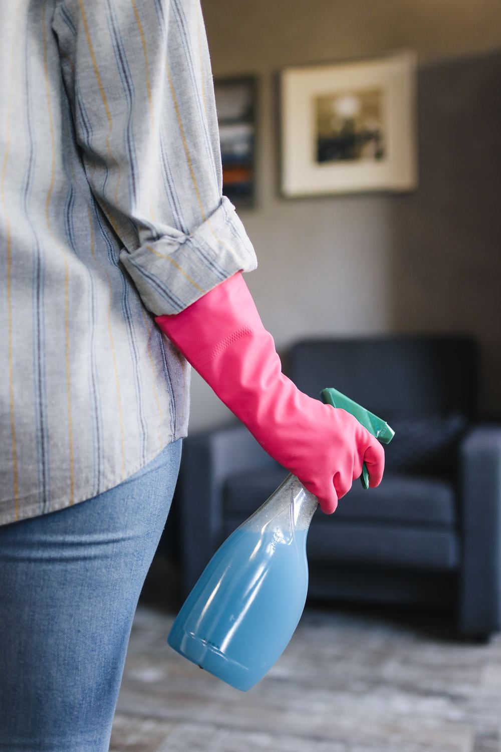 A cleaner arriving with a spray bottle