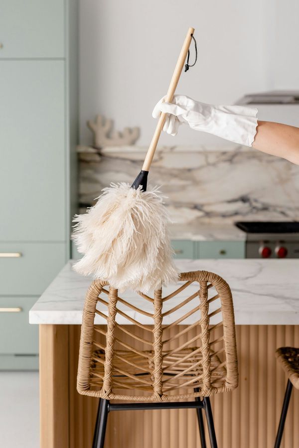 A duster reaching every surface during a Good Maid Cleaning visit