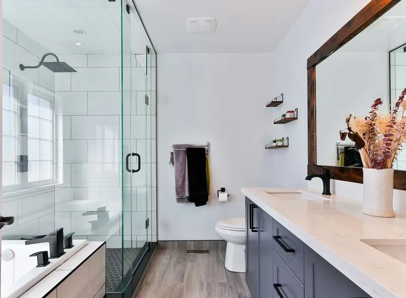A clean bathroom with a clear glass shower